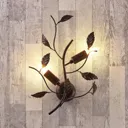 Metal wall light Yos adorned with leaves