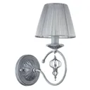 Monsoon wall light with a grey organza lampshade