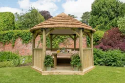 Forest Hexagonal Thatched Roof Gazebo with Table, Benches & Cream Cushions 3.6m Treated Timber (Installed)