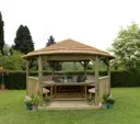 Forest Hexagonal Thatched Roof Gazebo with Table, Benches & Cream Cushions 4.7m Treated Timber (Installed)