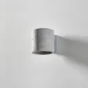 Ara wall light as a concrete cylinder